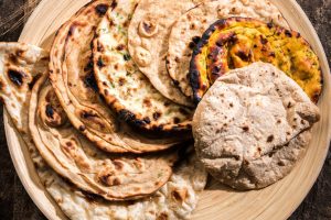 assorted naans and kulchas